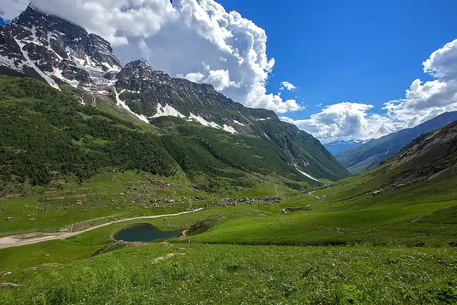 an image of shounter valley and a its lake with beautiful views of green mountains