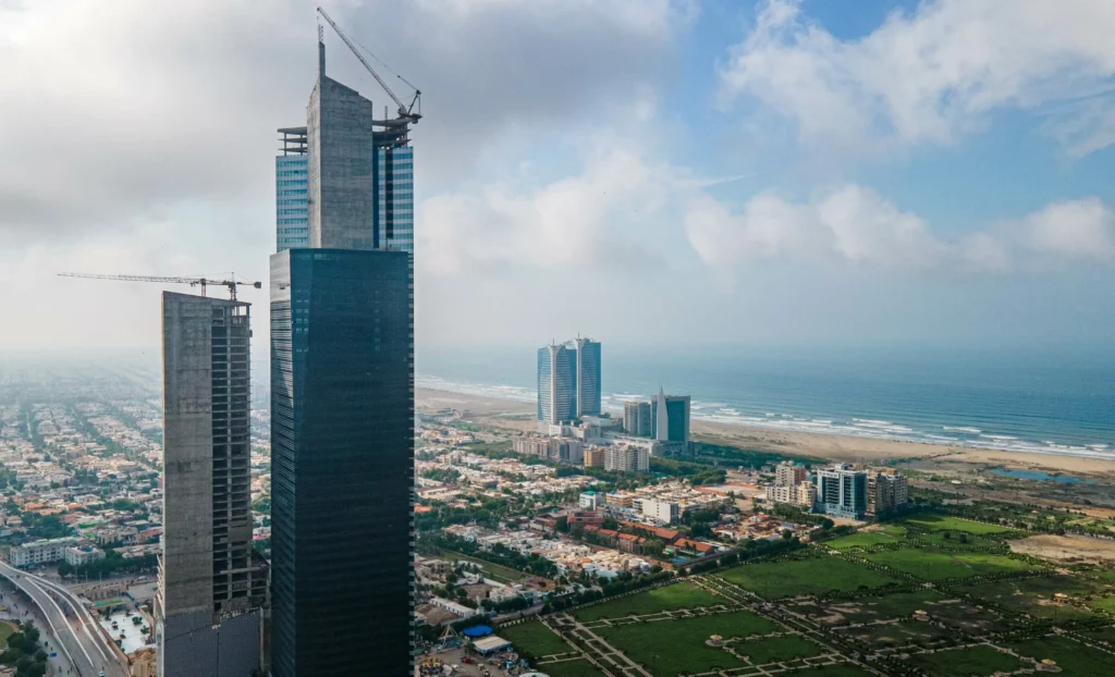 an image of karachi city's buildings and sea which is one of the best places to visit in Pakistan