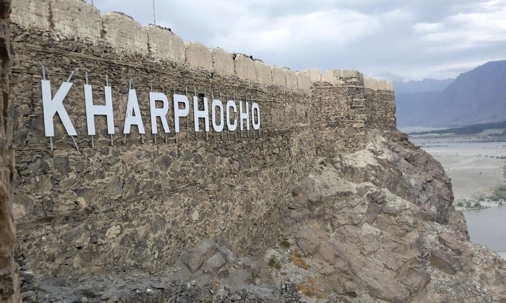 an image of wall of skardu fort. on the wall kharpocho is written which is another name of this fort