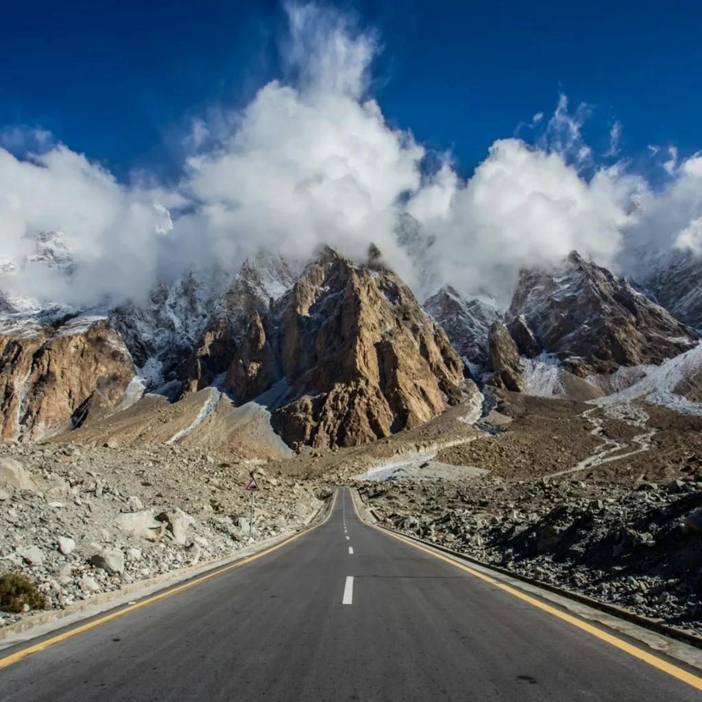 an image of reading heading toward cloudy mountains