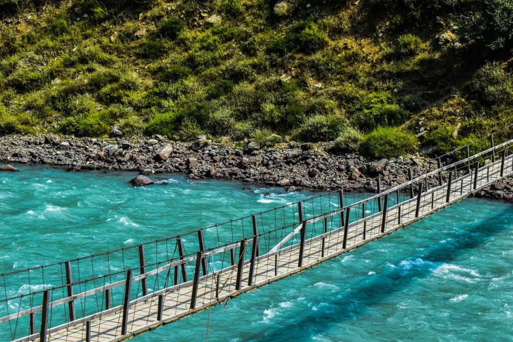 an image of swat in which a bridge over a blue water lake